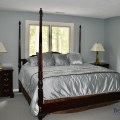 F22. Drexel Heritage Heriloom Collection king mahogany four-post bed. 